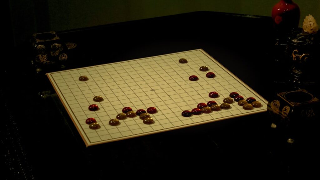 A board game set up in a dark room